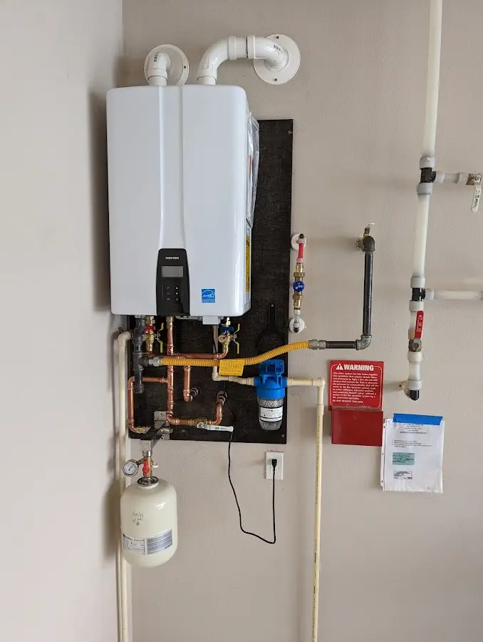 Professional plumber installing copper piping in a White Settlement home